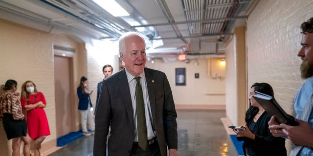 Sen. John Cornyn, R-Texas, arrives to meet with Sen. Chris Murphy, D-Conn., and Sen. Kyrsten Sinema, D-Arizona, for more bipartisan discussions on how to curb gun violence on Capitol Hill in Washington 15 June 2022. 
